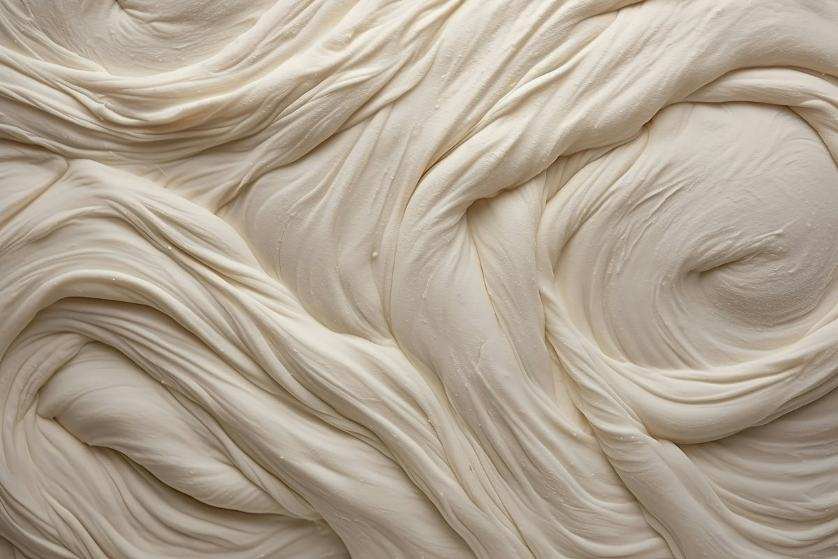 a close up of a cream colored surface