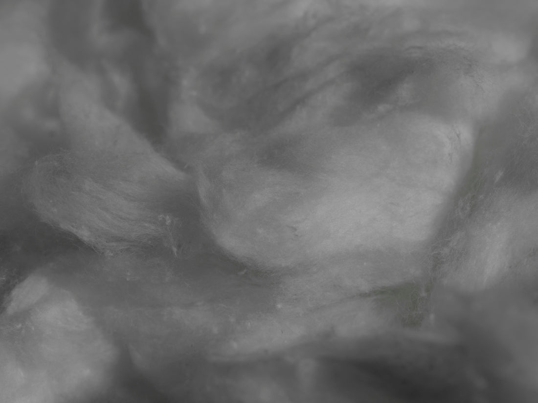 a black and white photo of a pile of cotton