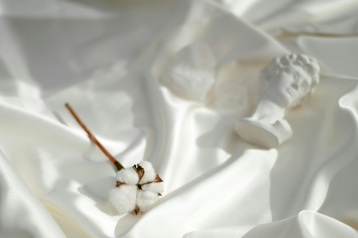 A close up of a white cloth with cotton