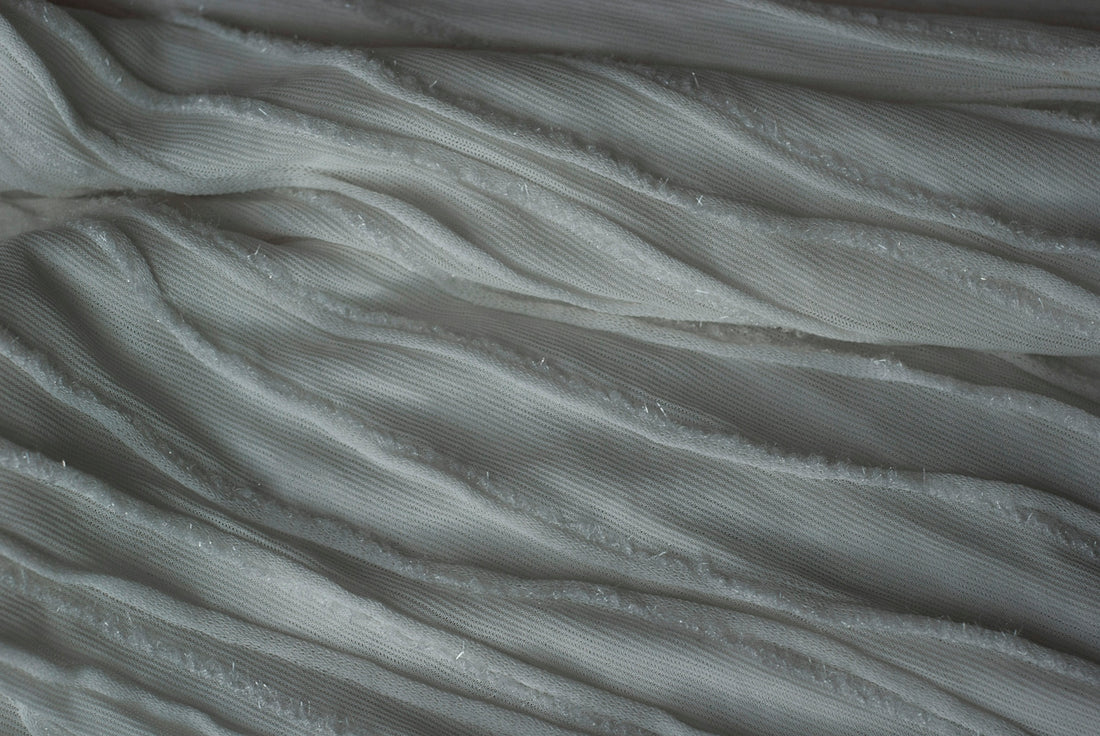 A close up view of a white blanket