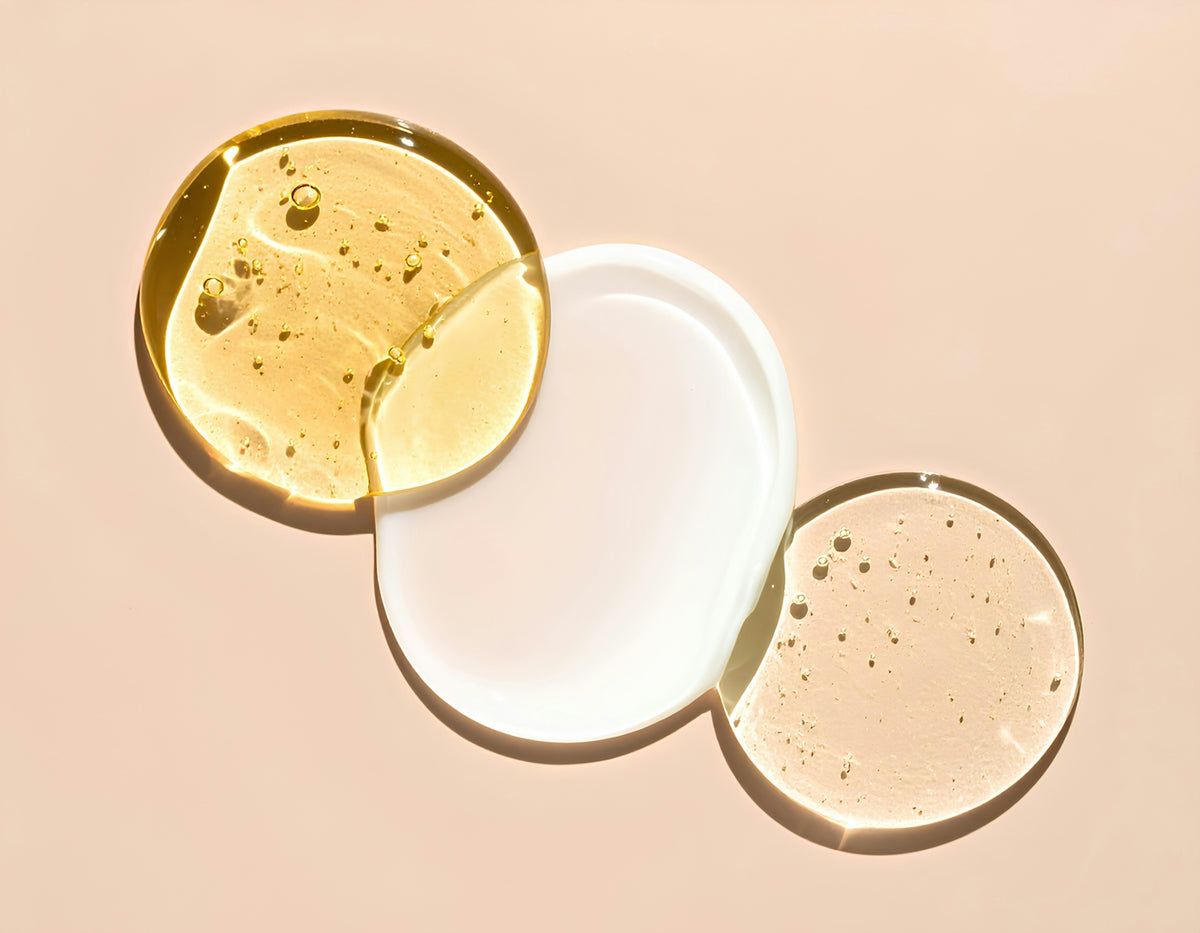 Different serums or lotions are arranged artfully